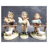 Three children figurines