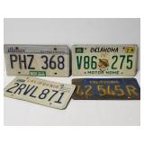 Four assorted states license plates