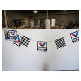 Two Valvoline garage flag banners