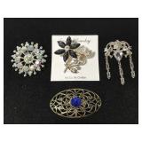 Silver toned brooch collection
