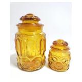Two amber glass canister jars