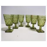 Six green glass goblets