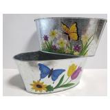 Two floral and butteryfly planter tins
