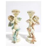 Pair of ornate Cherub candlesticks