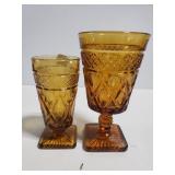 Two amber glass goblets
