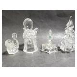 Four small glass candlestick holders