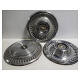 Three 15in metal Chevy hub caps