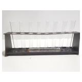 Vintage vial tubes in metal stand