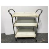 Old three tiered metal rolling cart
