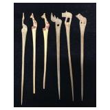 Wood carved animal swizzle sticks / pics