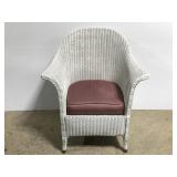 White wicker chair w/ spring loaded cushion