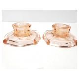 Two pink glass candlestick holders