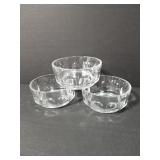 Three small dimpled glass bowls