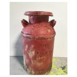 Old vintage red milk canister