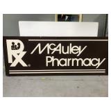 Huge wooden pharmacy advertising sign