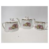 Porcelain teapot, sugar and creamer