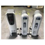 Three electric radiant space heaters