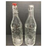 Pair of tall glass bottles w/ fruit detail