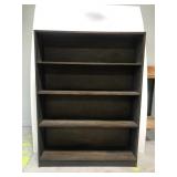Dark wood bookcase shelf