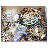 Assorted beads, charms and jewelry