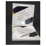 Two boxes of mirrored tiles