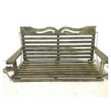 Old weathered wood porch bench swing