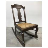 Small armless rocking chair w/ cane seat