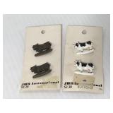 Two sets of cow buttons