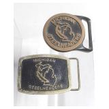 Two Michigan Steel Headers belt buckles
