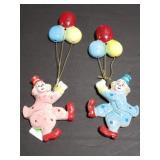 Pair of ceramic clowns with balloons wall art