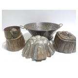 Old vintage metal molds and colander