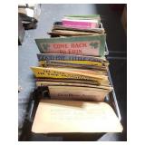 Two milk crates full of vintage sheet music