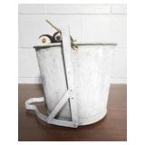 Vintage metal pail with wood wringer