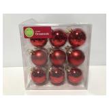 Festive red glass ornaments in packaging