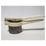 Vintage porcelain enamel potato ricer