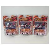 Three sealed Dale Earnhardt Jr. car+ card sets