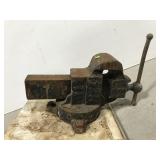 Old bench vice mounted on wood board