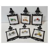 Six cast metal & tile early auto trivets