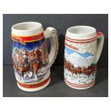 Budweiser holiday steins; 1985 and 1999; 2 pcs.