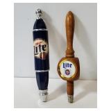 Two Miller Lite beer tap handles
