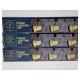Three track lighting sets in boxes