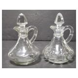 Two small glass oil decanters