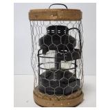 Vintage Dietz lantern inside chicken wire cage