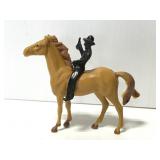Vintage plastic cowboy riding a horse toy
