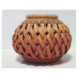 Signed woven basket