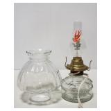 Converted oil lamp with bird bulb