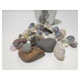 Tin of polished stones and rocks