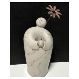 Whimsical terra cotta solar statue