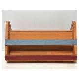 Old wooden colorful hanging book magazine rack