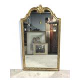 Wood framed gold toned wall mirror